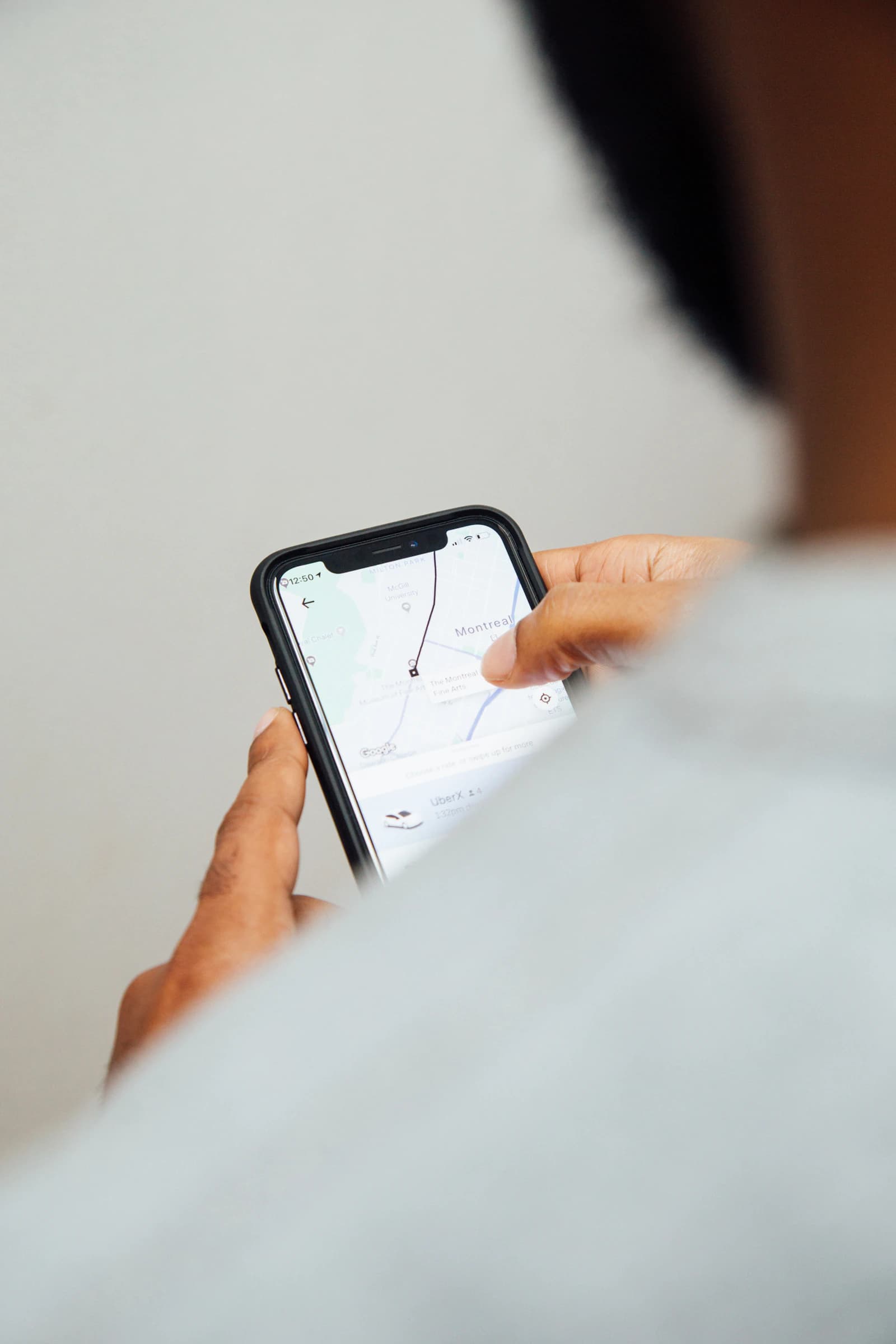 Person looking up a local business on a map on their phone